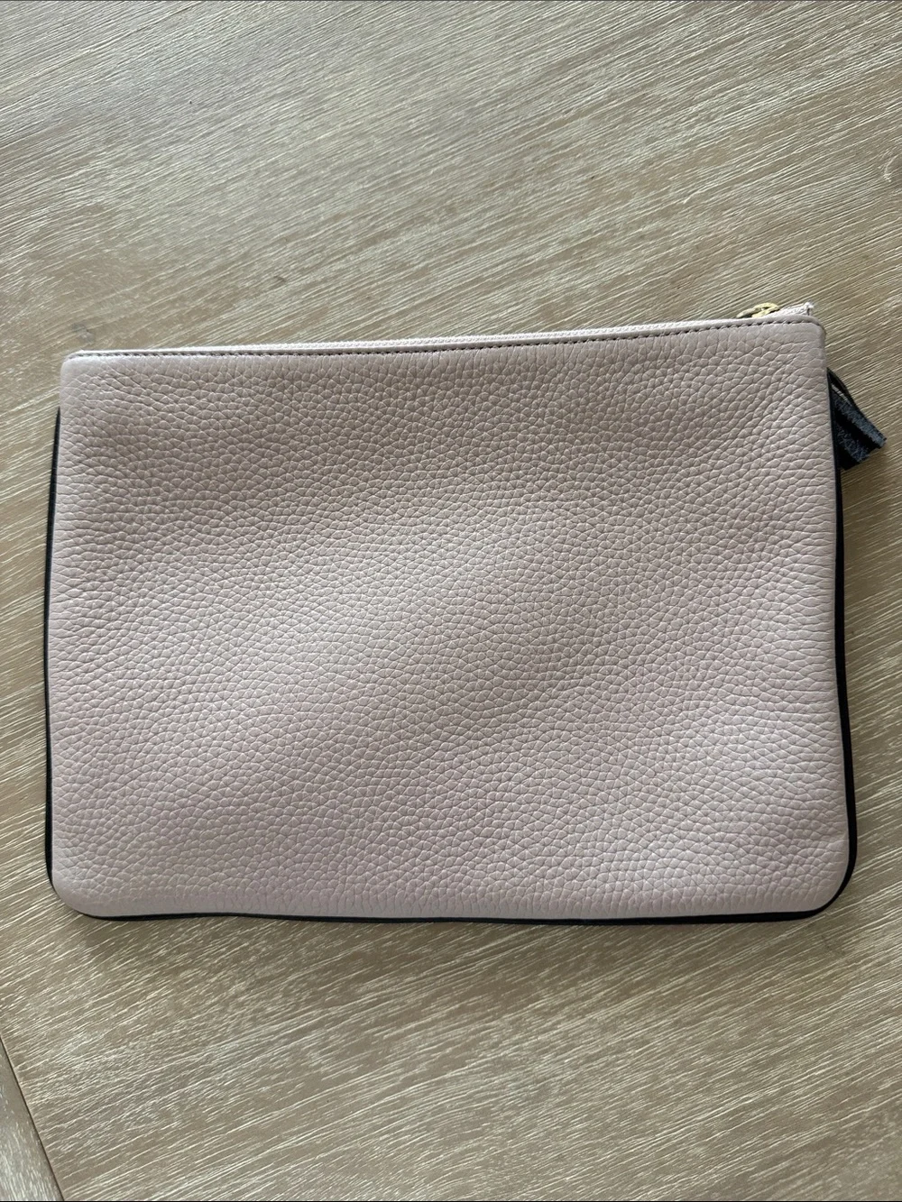 kate spade blush pink pebbled leather clutch with black tassel trim